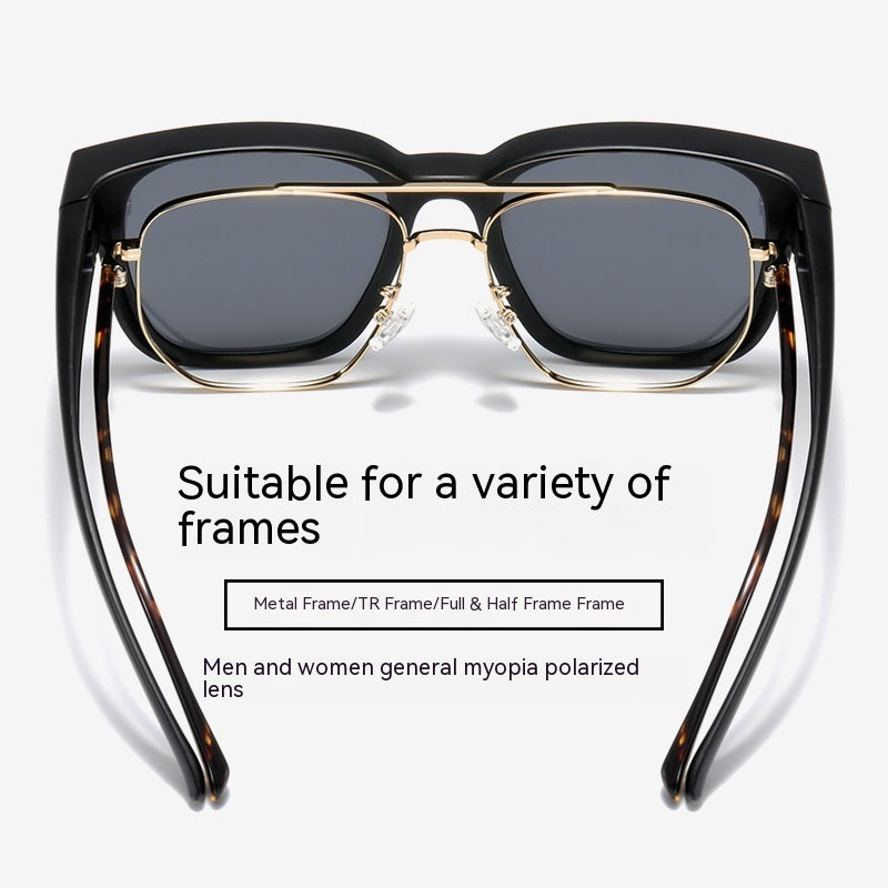 Sunglasses with black and gold frame on a white background