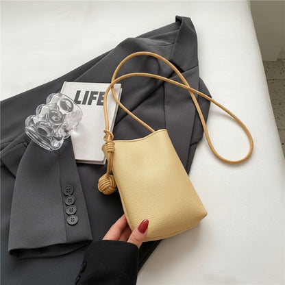 Mini phone crossbody bag in yellow PU leather