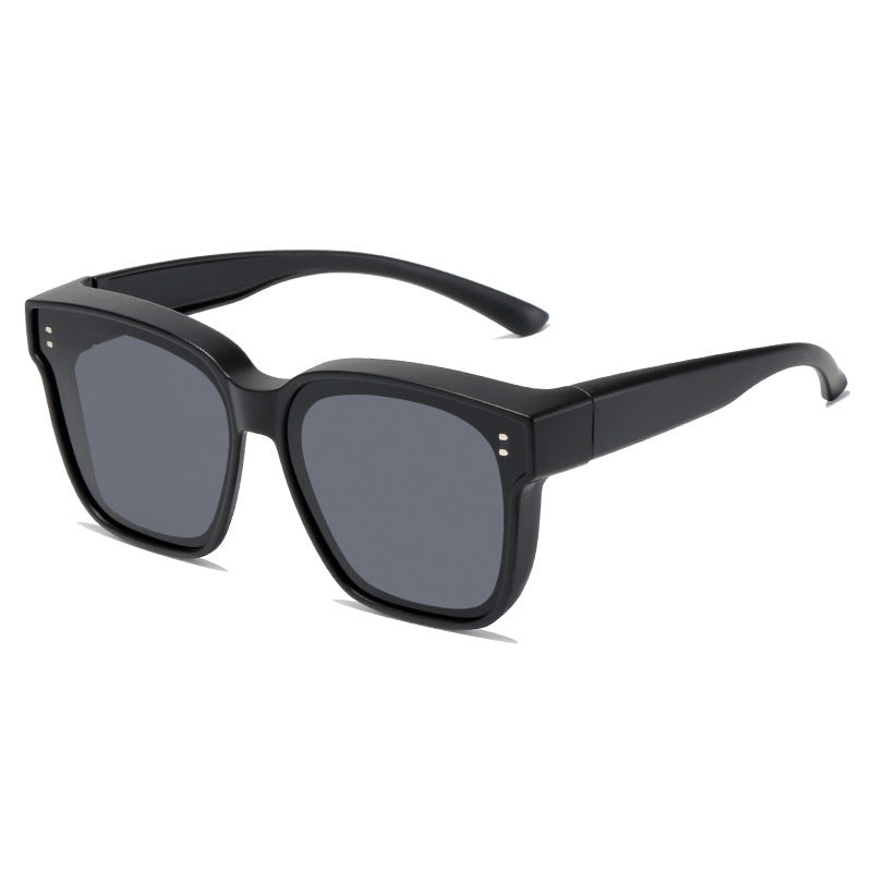 Polarized driving sunglasses designed to fit over prescription eyewear