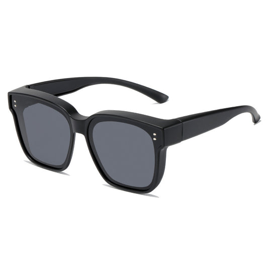 Polarized driving sunglasses designed to fit over prescription eyewear