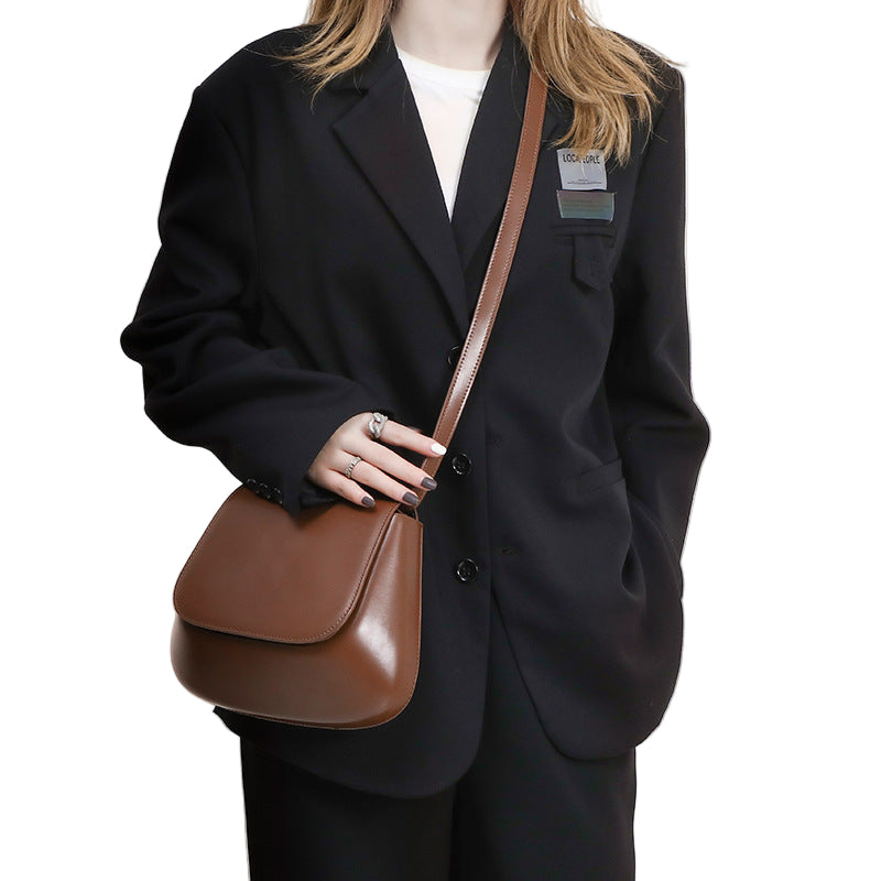 Brown PU leather saddle shoulder bag by B & P Atelier