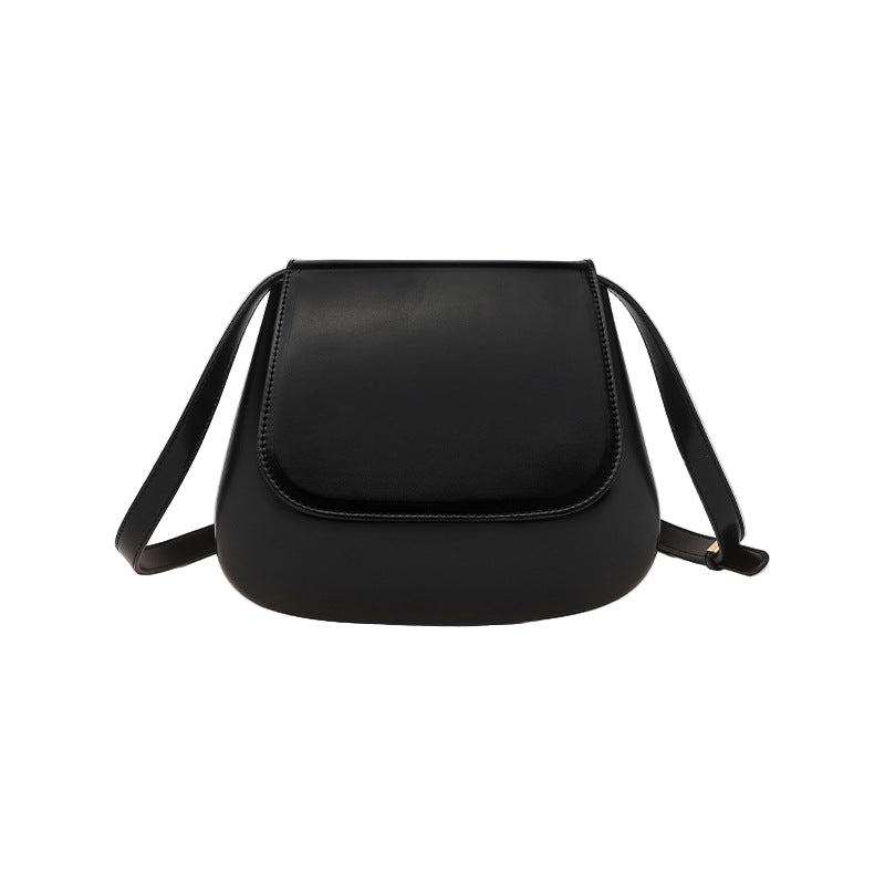 Black PU leather saddle shoulder bag by B & P Atelier