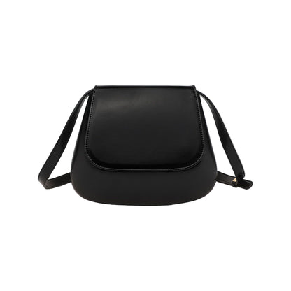 Black PU leather saddle shoulder bag by B & P Atelier