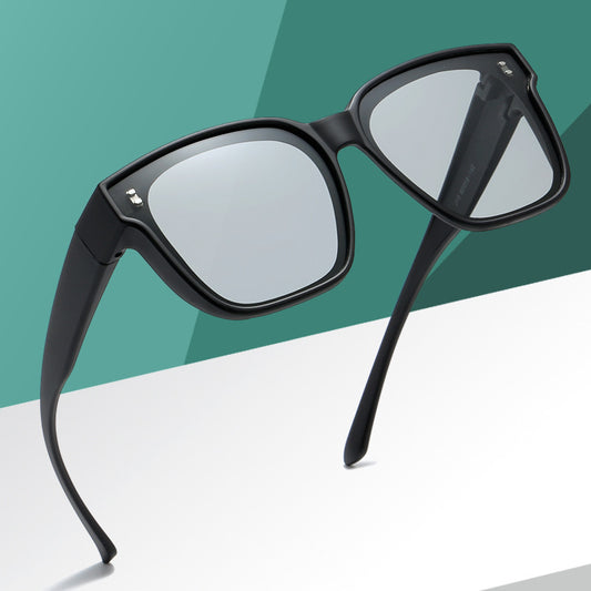Polarized driving sunglasses designed to fit over prescription eyewear